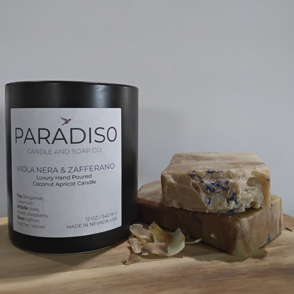Paradiso candle and soap on a wooden board with a white background
